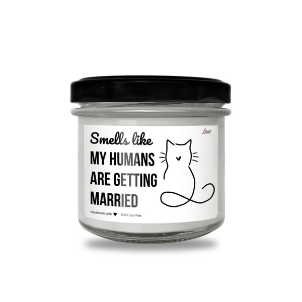 a jar of white candles with a black lid