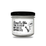 a jar of white candles with a black lid