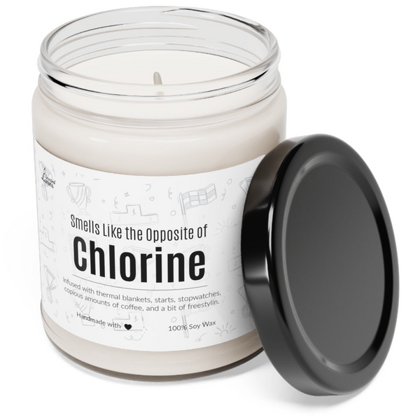 a candle with a black lid sitting next to it