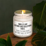 a white candle sitting on top of a wooden table