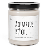 a jar of aquarius bitch candle sitting on a white surface