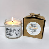 a candle that is sitting next to a box