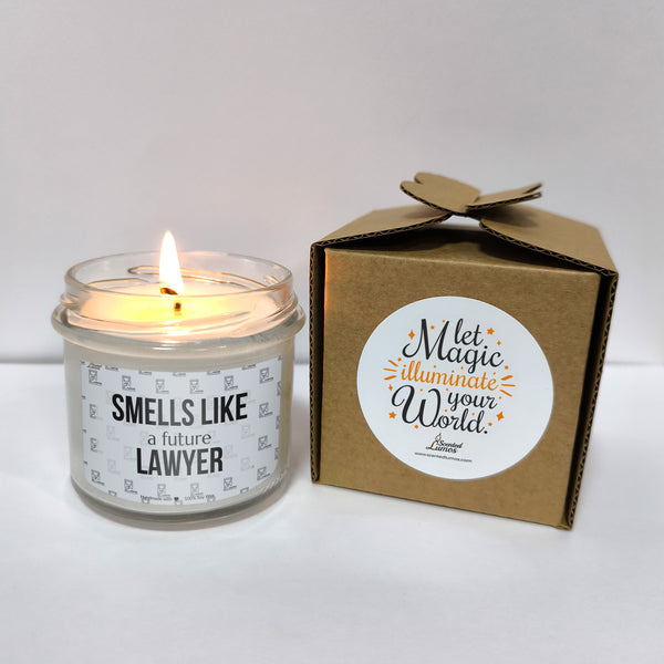 a candle that is sitting next to a box