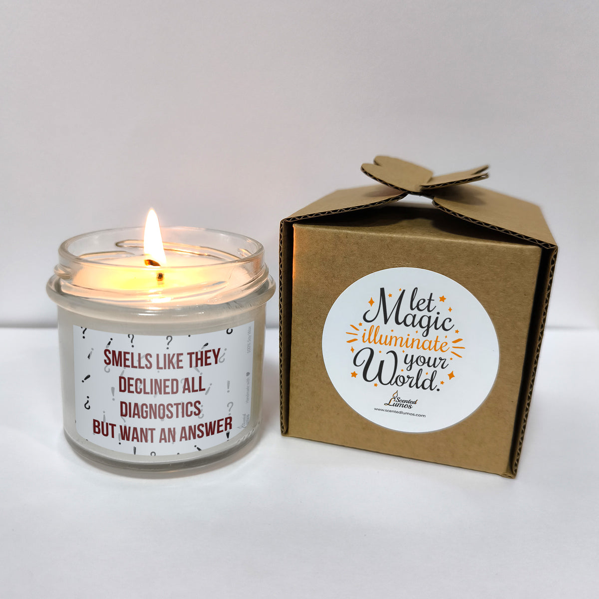 a candle that is next to a box