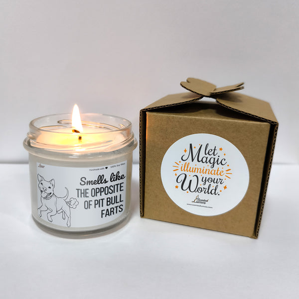 a candle that is sitting next to a box