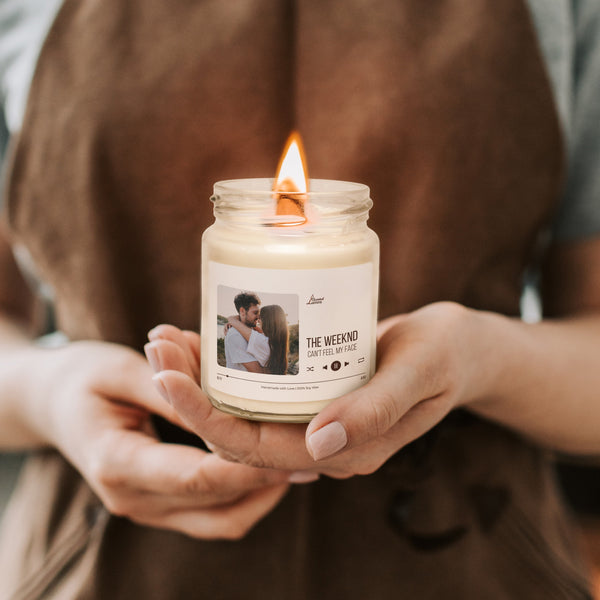 a person holding a candle in their hands