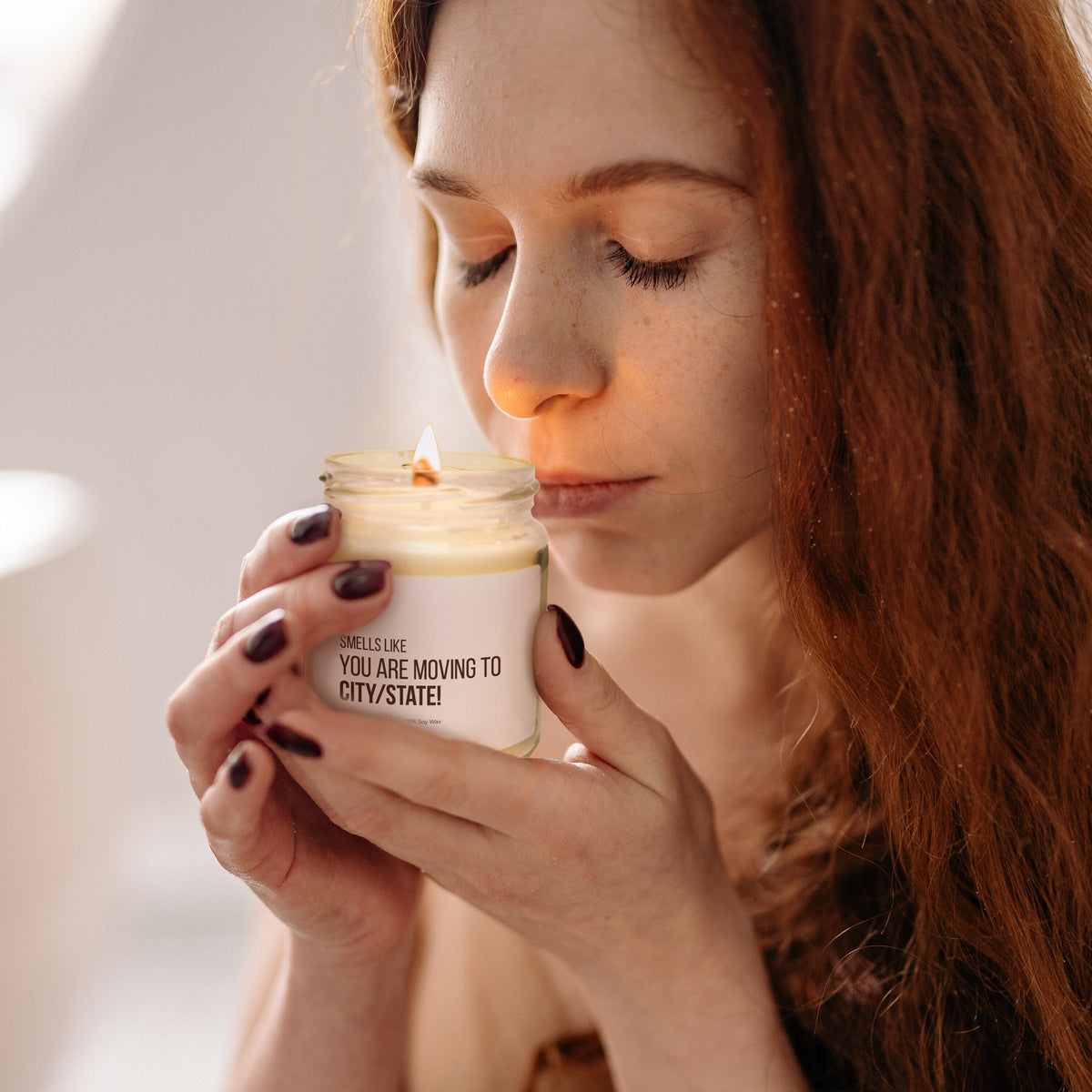 a woman holding a cup of coffee in her hands