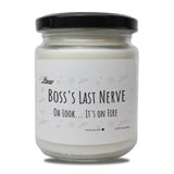 a jar of white candle that says boss's last nerve on it