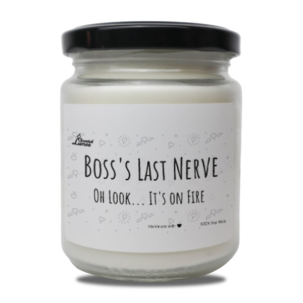 a jar of white candle that says boss&#39;s last nerve on it