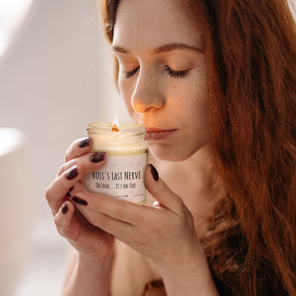 a woman holding a jar of cream in her hands