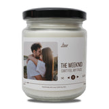 a jar of the weekend candle with a picture of a man hugging a woman
