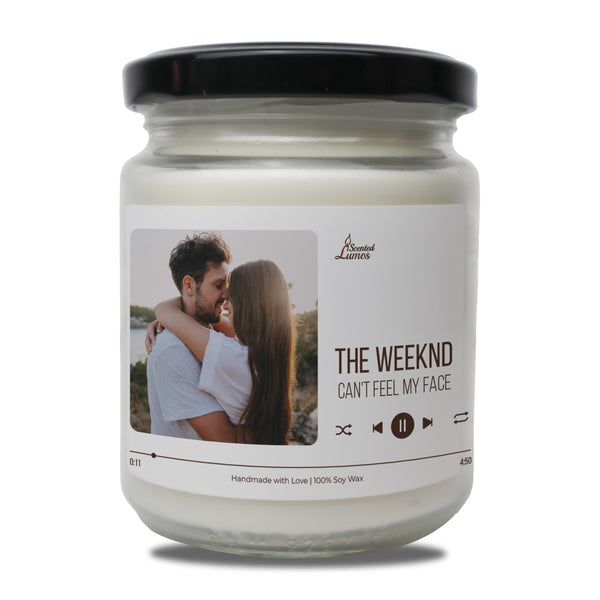 a jar of the weekend candle with a picture of a man hugging a woman