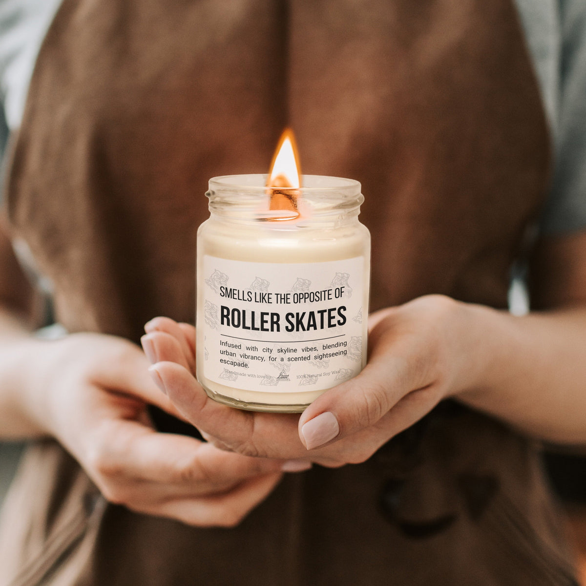 a person holding a candle in their hands