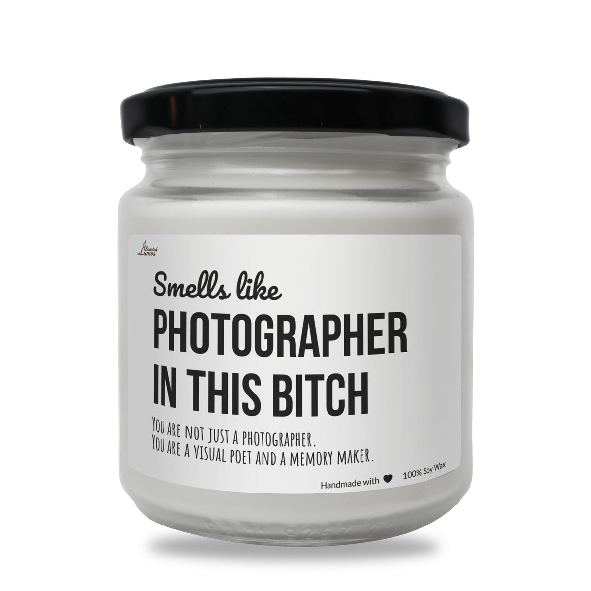 a white jar with a black lid that says, smell like photographer in this bitch