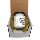 a small jar of dog poop sitting inside of a box