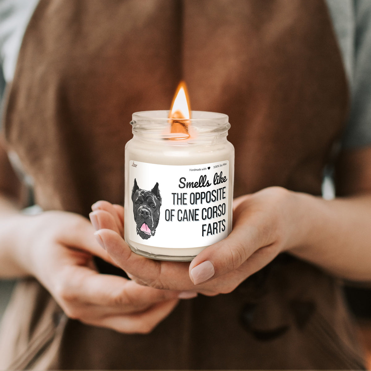 a person holding a candle in their hands