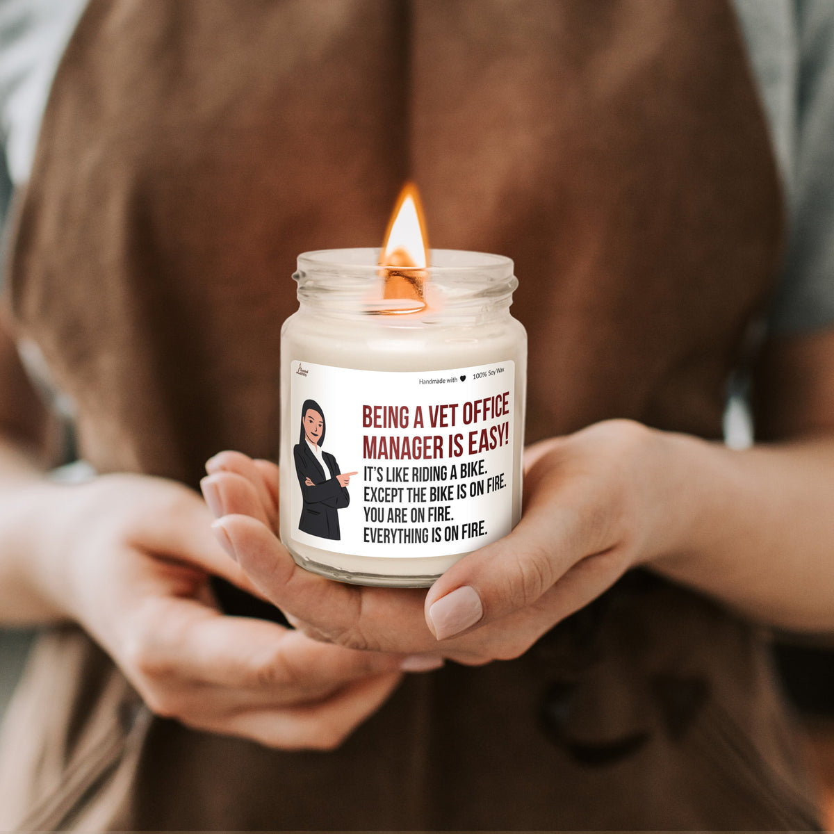 a woman holding a candle in her hands