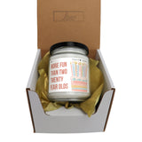 a jar of birthday candles in a gift box