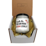 a jar of drink sitting inside of a box