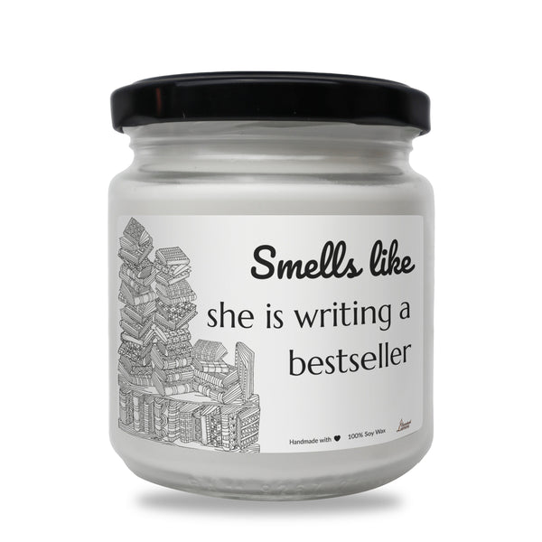 a white jar with a black lid that says smells like she is writing a best