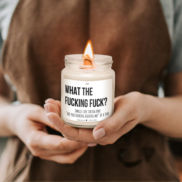 a person holding a candle in their hands