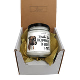 a small jar of dog food in a box
