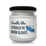 a white jar with a black lid that says smells like i should't give