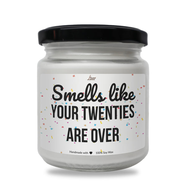 a jar of white candles that says smell like your twenties are over