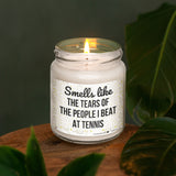 a candle that reads smell like the tears of the people i beat at tennis