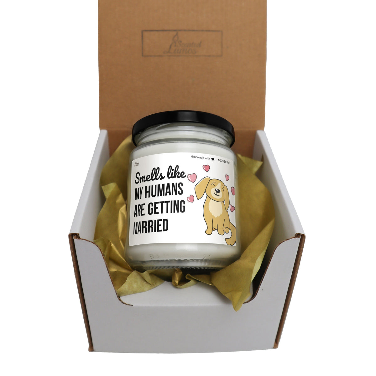 a candle in a box with a ribbon around it