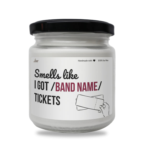 a white jar with a black lid that says smells life i got / band name
