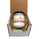 a candle in a box that is open