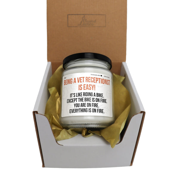 an open box with a candle inside of it