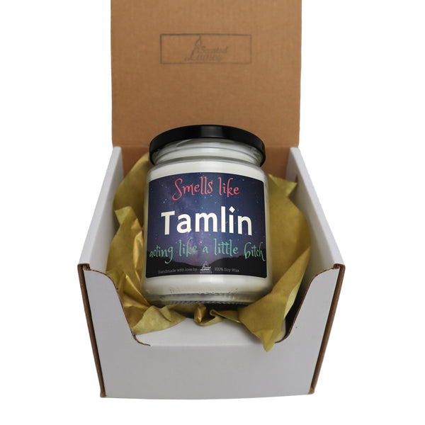 a small jar of tamlin sits in a box