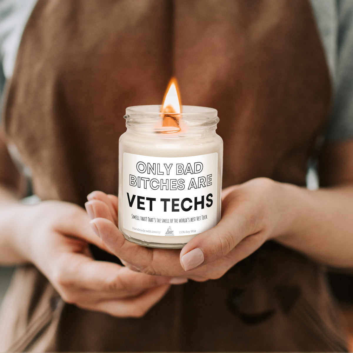 a woman holding a jar of vet techs