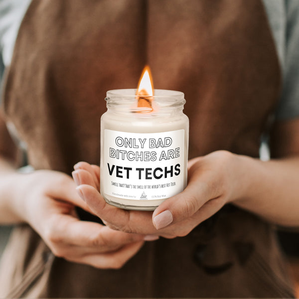 a woman holding a jar of vet techs