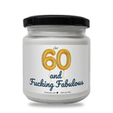 a white jar with a black lid that says 60 and fucking fabulous