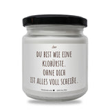 a white jar with a black lid on a white background