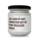 a white jar with a black lid on a white background