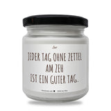 a white jar with a black lid and a black lid