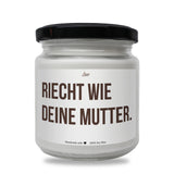 a white jar with a black lid that says reicht wie deine mu