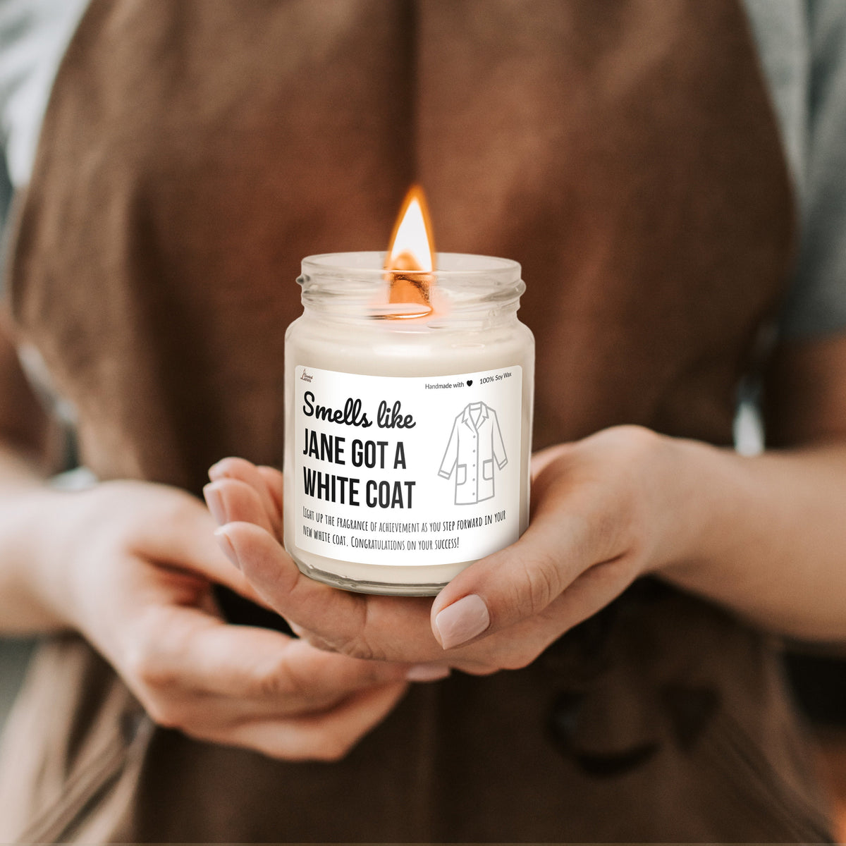 a person holding a candle in their hands