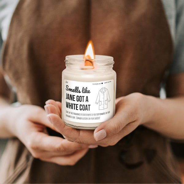 a person holding a candle in their hands