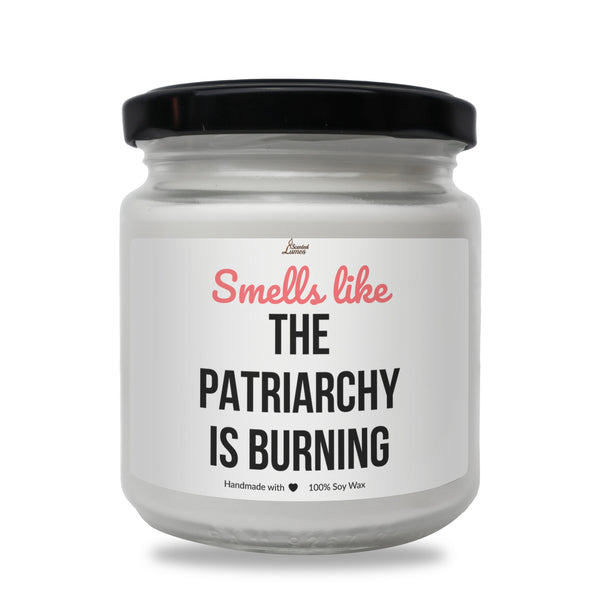 a white jar with a black lid that says smell like the patriachy is