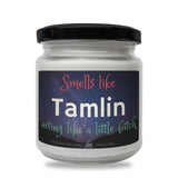 a jar of tamlin sitting on a white surface