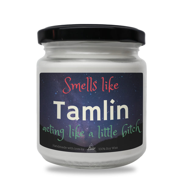 a jar of tamlin sitting on a white surface