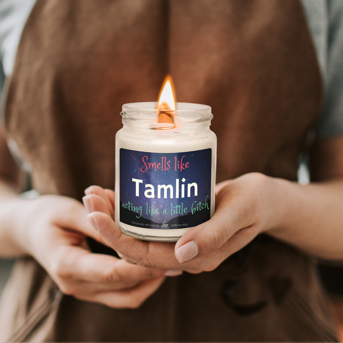 a person holding a candle in their hands