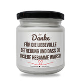 a jar of white wax with a black lid