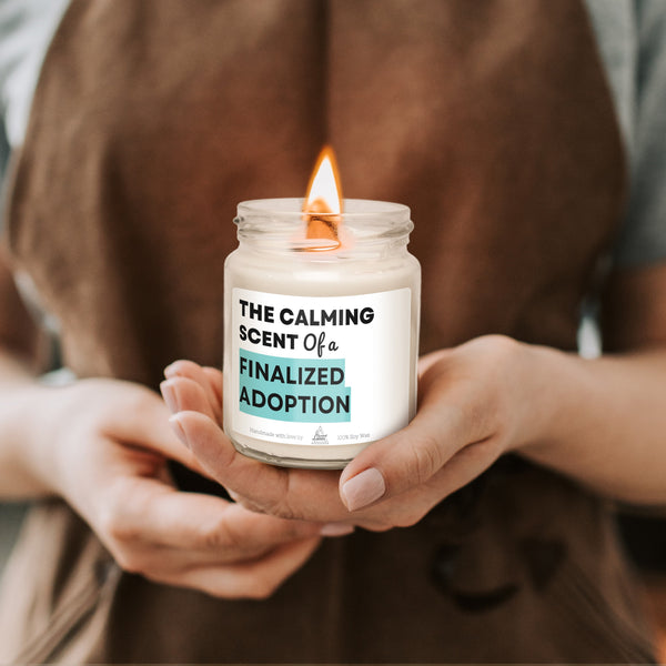 a person holding a candle in their hands