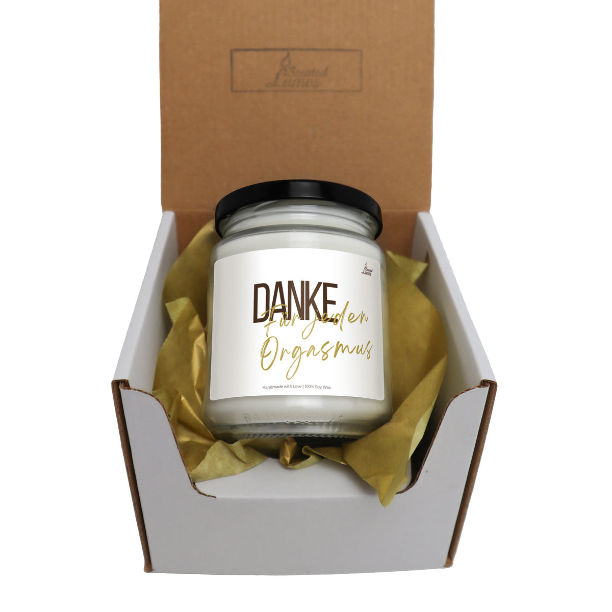 a candle in a box with a ribbon around it